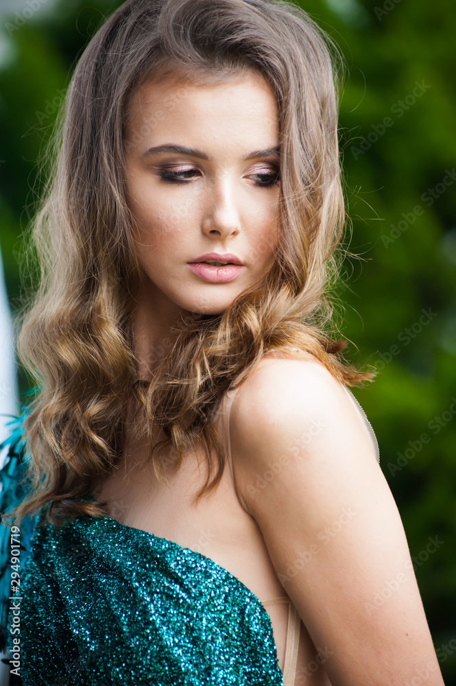 Exquisite young beautiful woman with hairstyle and makeup before the party Exquisite young beautiful woman with hairstyle and makeup before the party