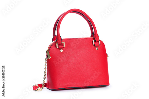 Fashionable red female hand bag on white background