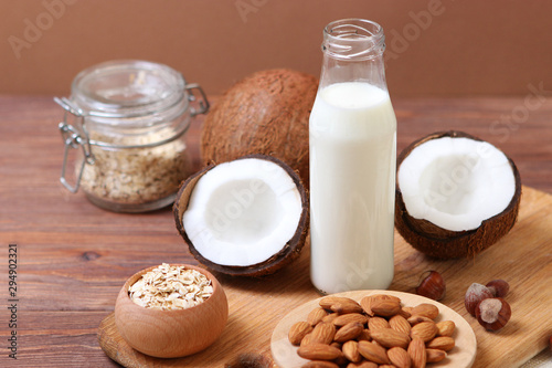 Different types of vegetable milk on the table. Coconut, oatmeal, hazelnut, almond milk. Vegetarian milk.