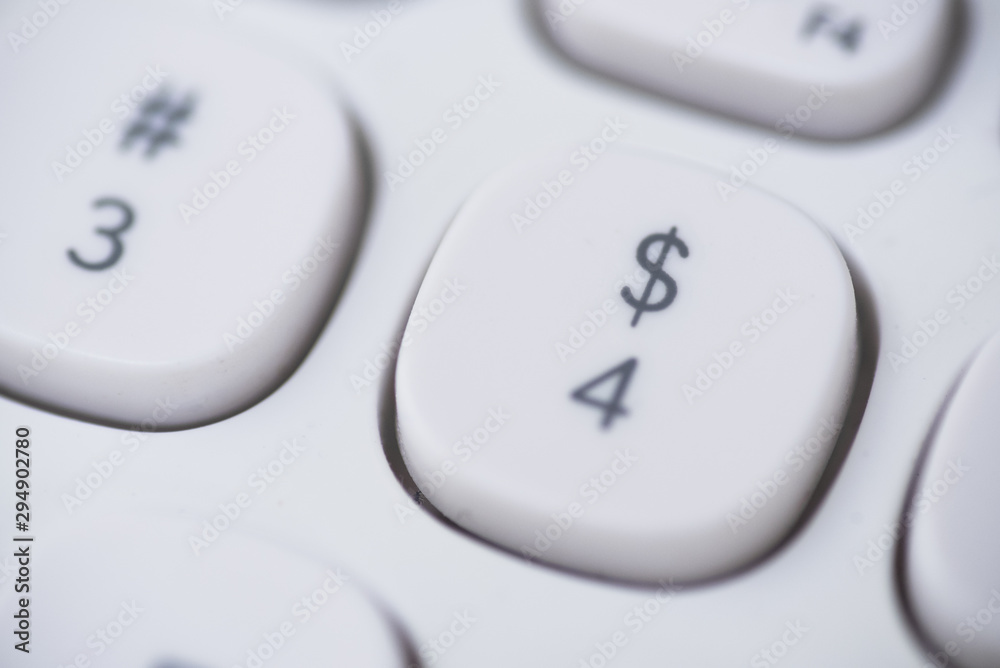 Close-up of number 4, dollar symbol key of a white keyboard. Close-up of number 4, dollar symbol key of a white keyboard.