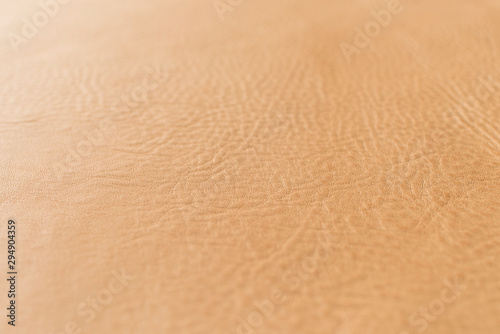 Tan, light, beige, natural color grainy, heavy grain calf cow leather texture and background.