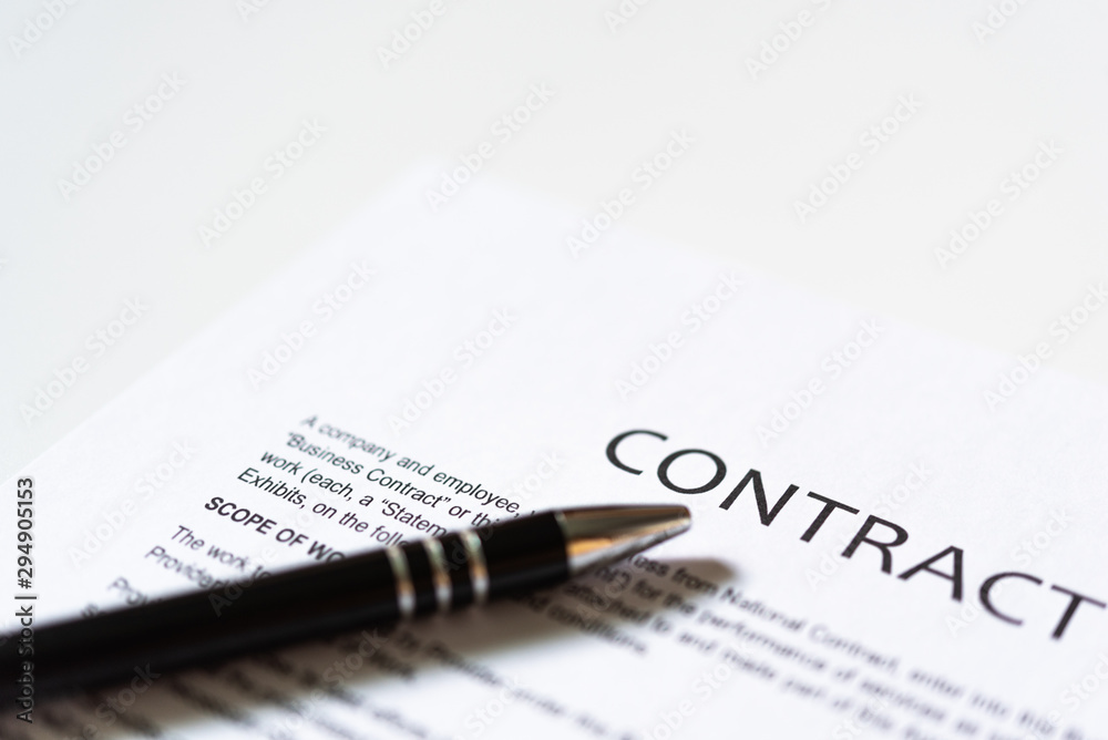 White table with business document contract form paper and empty space to sign authorized signature, copy space available for text White table with business document contract form paper and empty space to sign authorized signature, copy space available for text