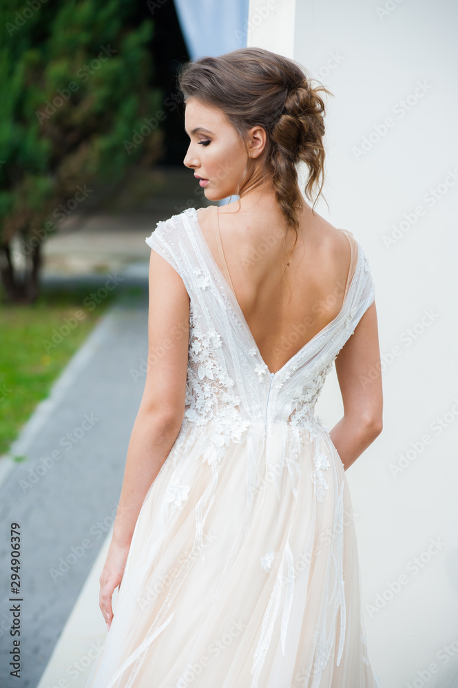 Beautiful bride with wedding flowers bouquet, attractive woman in wedding dress. Happy newlywed woman. Bride with wedding makeup and hairstyle. Smiling bride. Wedding day. Gorgeous bride. Marriage. Beautiful bride with wedding flowers bouquet, attractive woman in wedding dress. Happy newlywed woman. Bride with wedding makeup and hairstyle. Smiling bride. Wedding day. Gorgeous bride. Marriage.