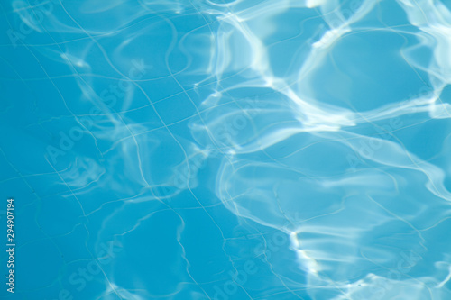 A close-up of sun reflections in pool water
