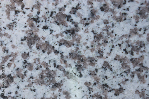 granite wall surface, facade, red-gray with black dots