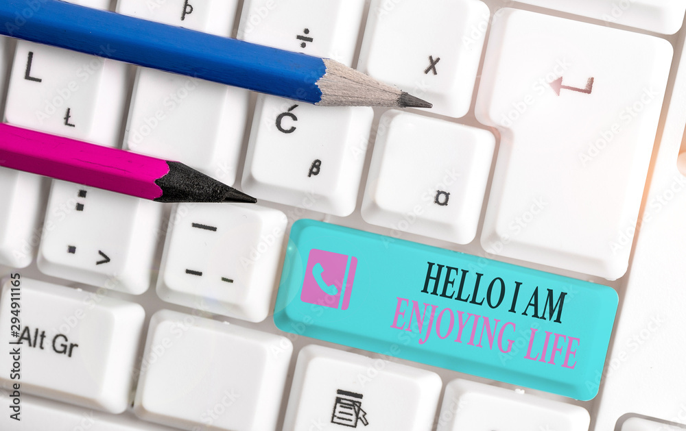 Word writing text Hello I Am Enjoying Life. Business photo showcasing Happy relaxed lifestyle Enjoy simple things White pc keyboard with empty note paper above white background key copy space Word writing text Hello I Am Enjoying Life. Business photo showcasing Happy relaxed lifestyle Enjoy simple things White pc keyboard with empty note paper above white background key copy space