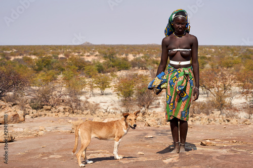 Mucubal tribe woman and her dog, Tchitundo Hulo, Virei, Angola photo