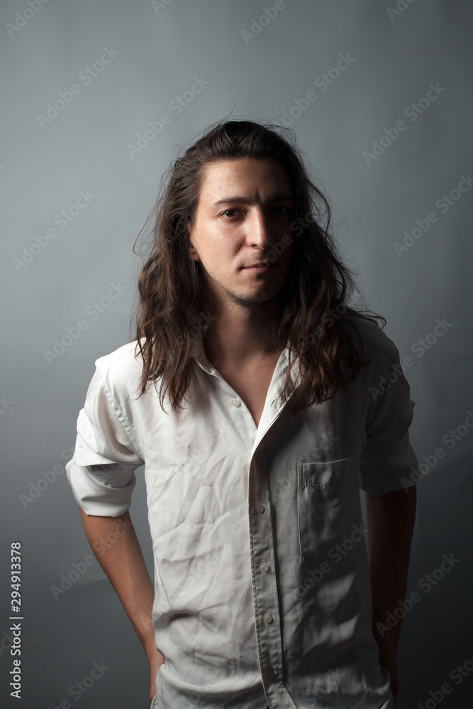Young man on gray background. Studio portrait Young man on gray background. Studio portrait