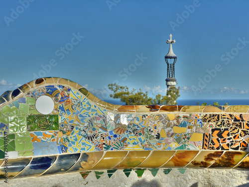 Colorful ceramic mosaic on benches in Park Guell, Barcelona.