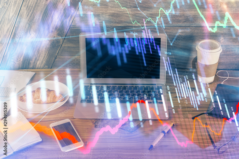Multi exposure of forex graph and work space with computer. Concept of international online trading. Multi exposure of forex graph and work space with computer. Concept of international online trading.