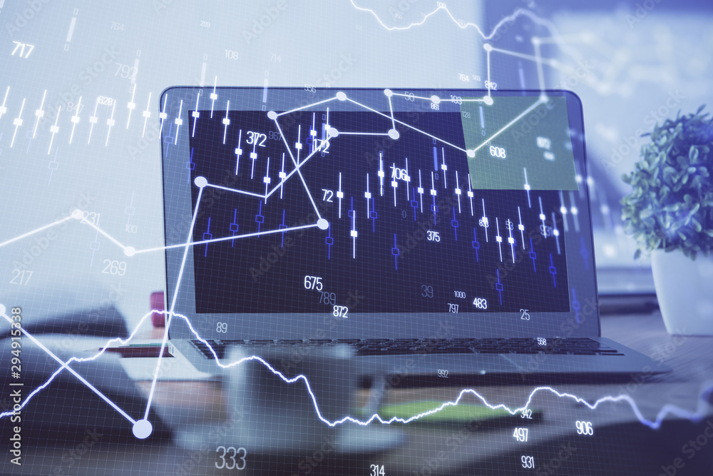Forex market graph hologram and personal computer on background. Double exposure. Concept of investment. Forex market graph hologram and personal computer on background. Double exposure. Concept of investment.