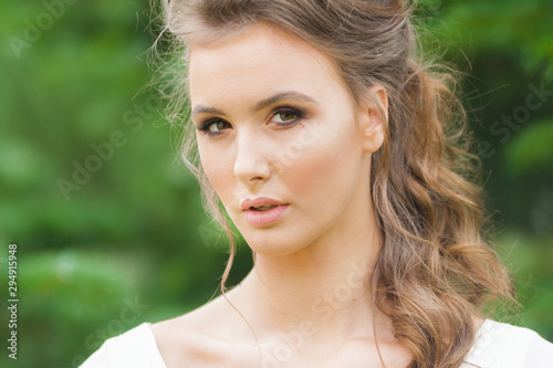Portrait of beautiful bride with beautiful hairstyle and makeup