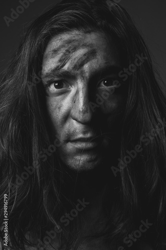 Portrait young man in soot. Black and white. Close up.