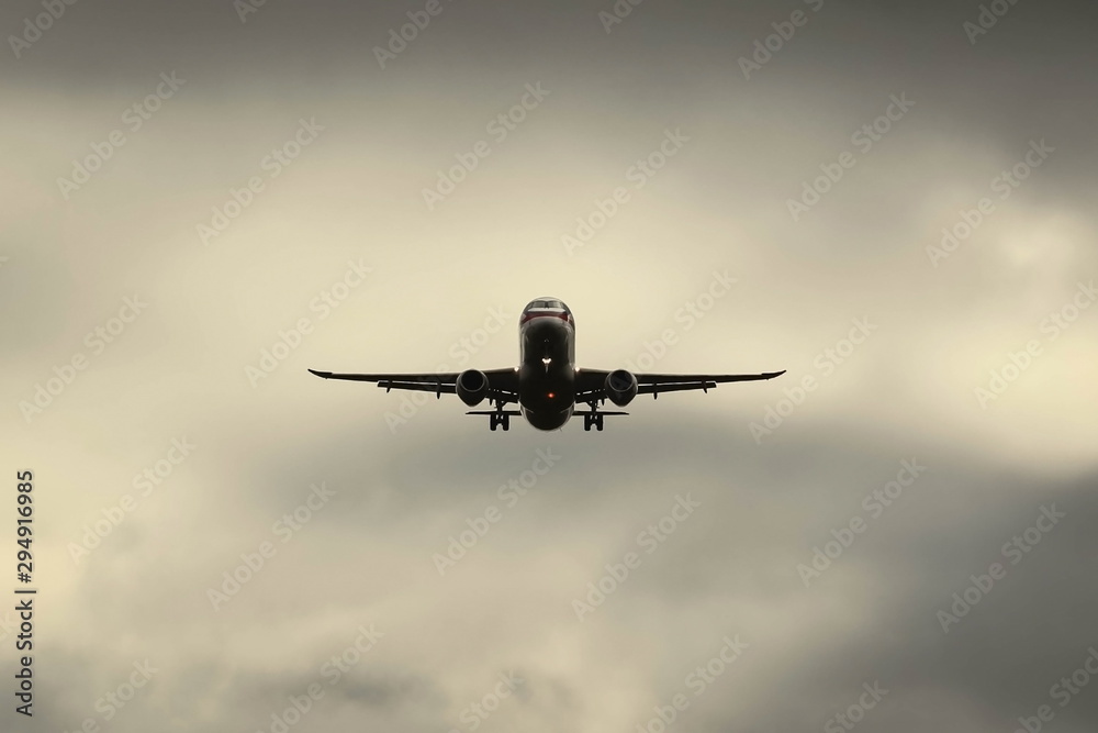 passenger aircraft in the sky at approach