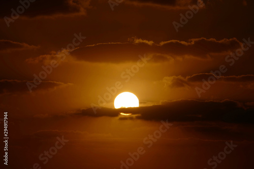 Fototapeta Naklejka Na Ścianę i Meble -  Sunset in Alghero, Sardinia, Italy. Capo Cassia in the background.