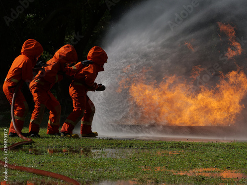 firefighter spray water to fire burning car workshop fire training