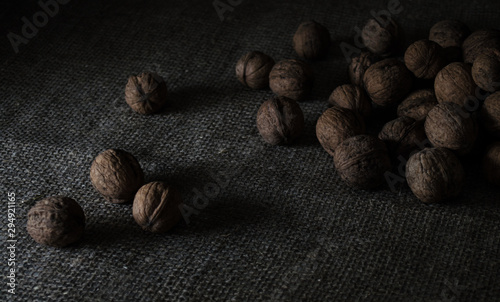 still life of walnuts on dark background