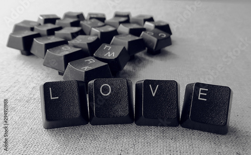 love word with heart symbol from black keyboard keys 
