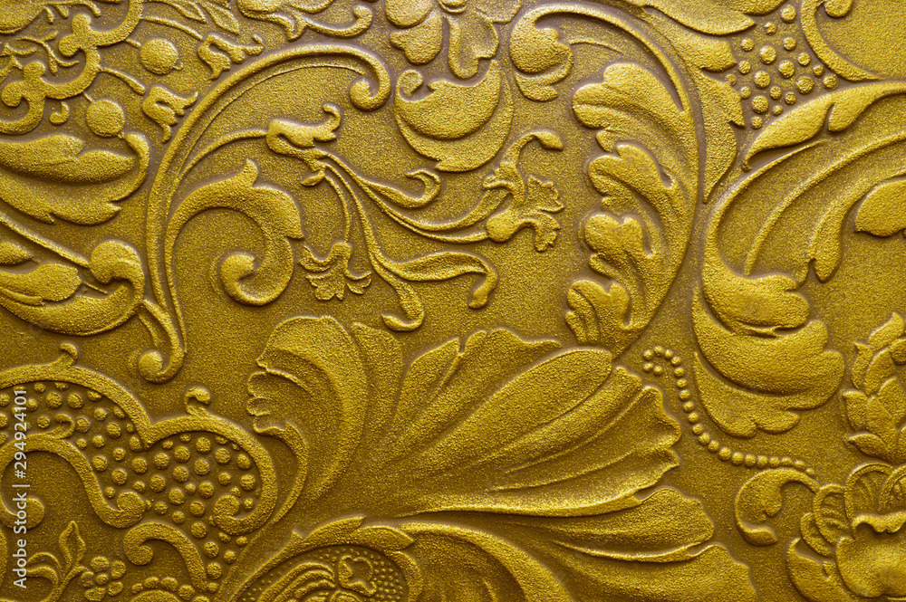 Decorative stucco with patterns in gold color