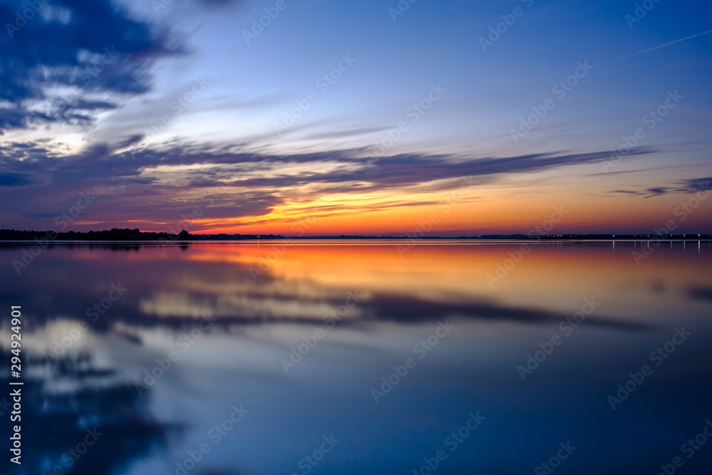 Sunset on the Supiy lake, Ukraine, Europe. Beautiful landscape with clouds reflections in water.