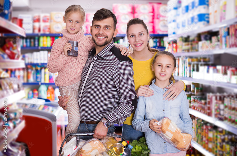 parents with girls with purchases during family shopping