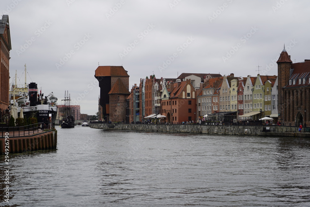 Fototapeta premium Gdansk, Poland - September 2019: The cargo ship Soldek is moored on the promenade in the city center. View of the city embankment and cargo ship Soldek.
