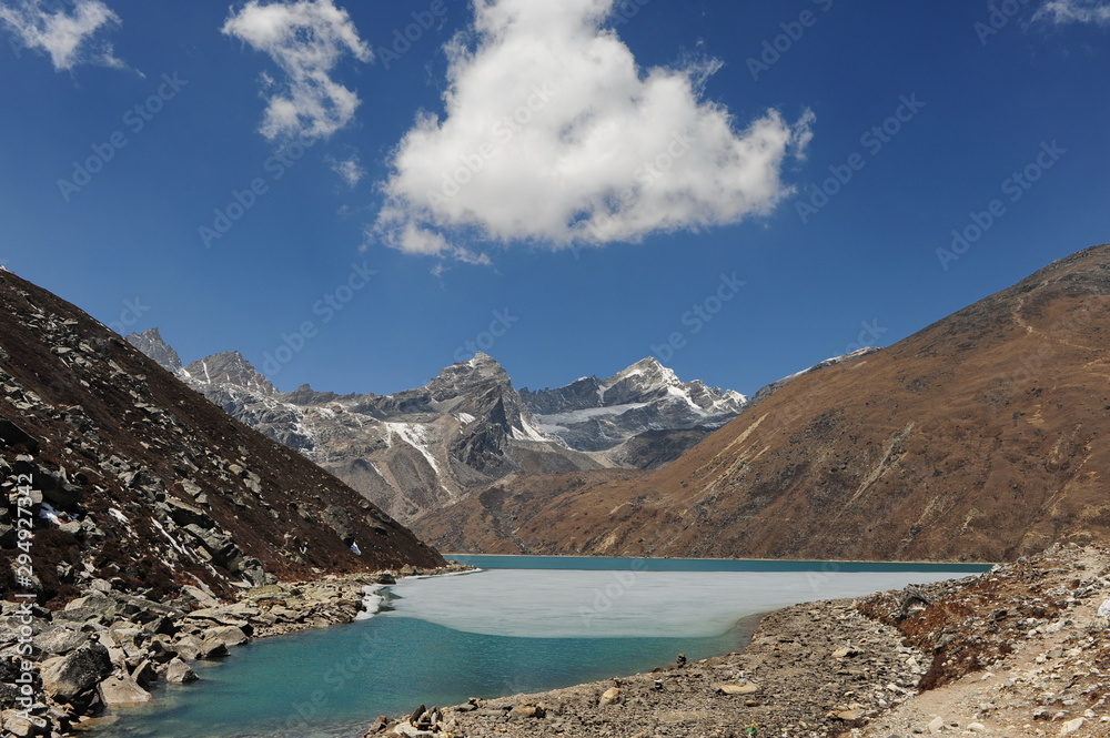 Nepal. Himalayan mountains. Snowy peaks of the Himalayas. Alpine glacial lakes. Snowy mountain peaks against the blue sky.