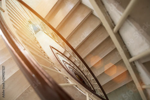 Fényképezés view from above modern staircase with marble luxury steps circular shape