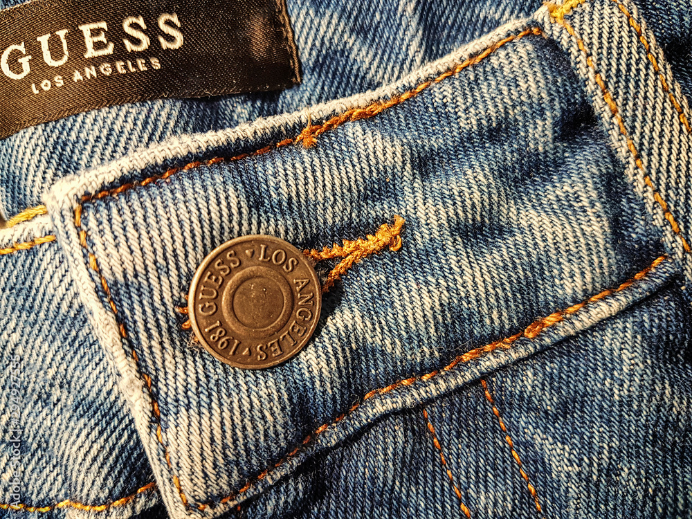 Krakow, Poland - February 21, 2018: Close-up of the Guess jeans button and  front details. Guess is a famous American clothing brand and retailer  founded in 1981. Stock Photo | Adobe Stock