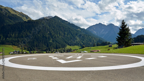 landschaft im kleinwalsertal mit hubschrauberlandeplatz photo