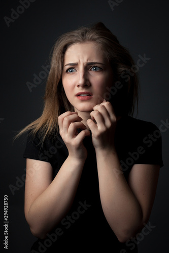 Portrait of scared young woman.