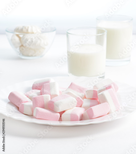 Marshmallows and milk. High key photography.