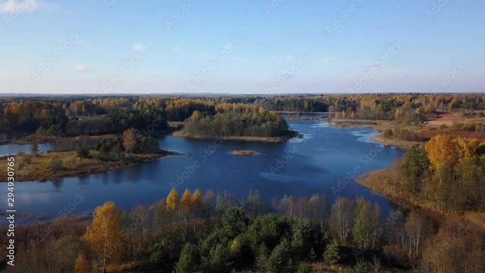 Aerial view over the lakes and forests in autumn. Latvia in Northern Europe. Drone slow dolly forward Aerial view over the lakes and forests in autumn. Latvia in Northern Europe. Drone slow dolly forward
