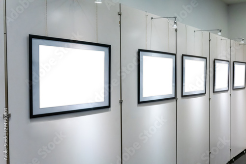 Empty art gallery with blank posters hanging on the walls.
