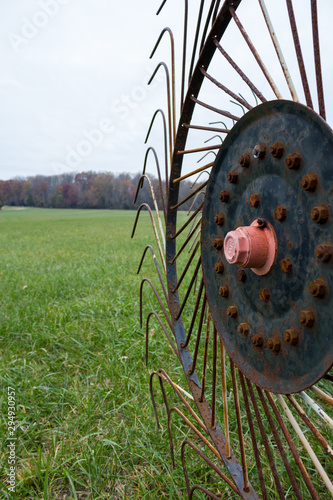 Obraz na plátně Old Rusting Metal Farm Equipment In A Field