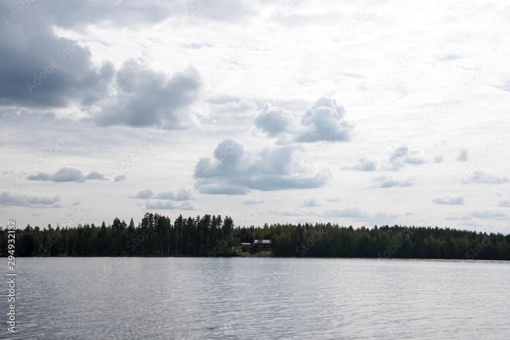 Summer view of the lake Hallanlahti with clouds on blue sky . Summer view of the lake Hallanlahti with clouds on blue sky .