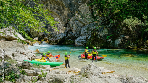 Photos A group of tourists prepare their canoes for a rafting trip down Soca river