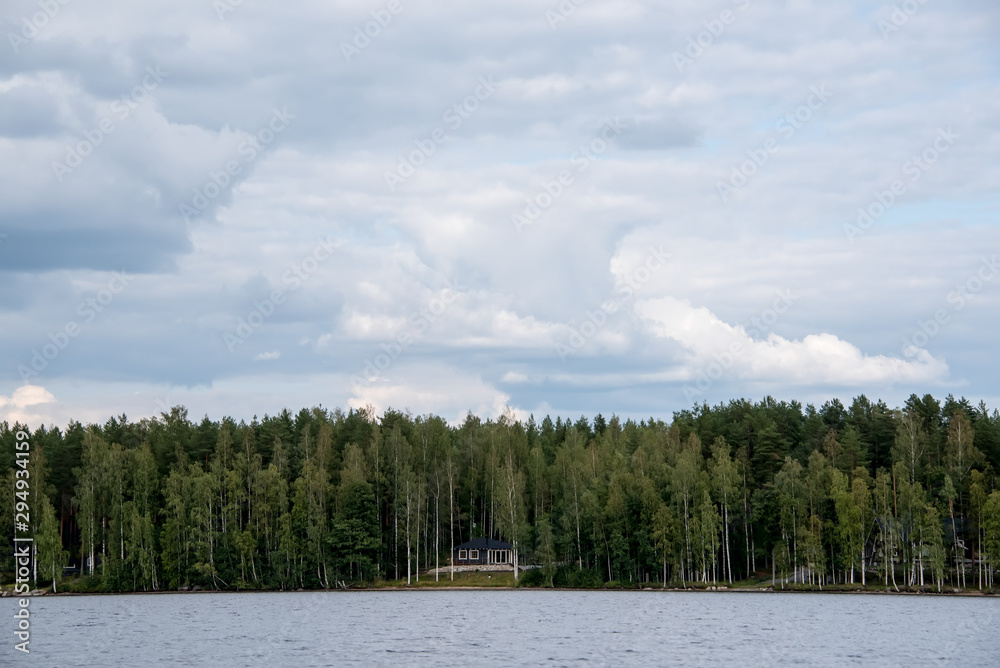 Lake Hallanlahti summer view with reflection of clouds on water . Lake Hallanlahti summer view with reflection of clouds on water .