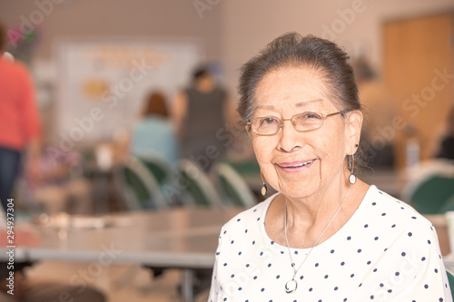 Smiling Hispanic Woman in a Senior Center
