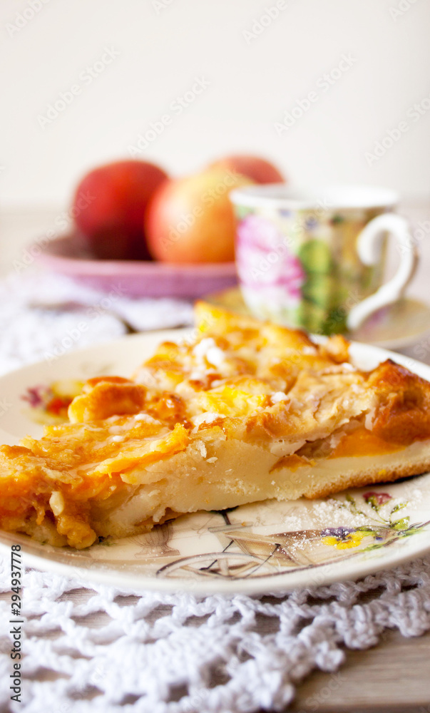 Homemade fruit apple apricot peach pie on white crochet napkin on white rustic table background Homemade fruit apple apricot peach pie on white crochet napkin on white rustic table background