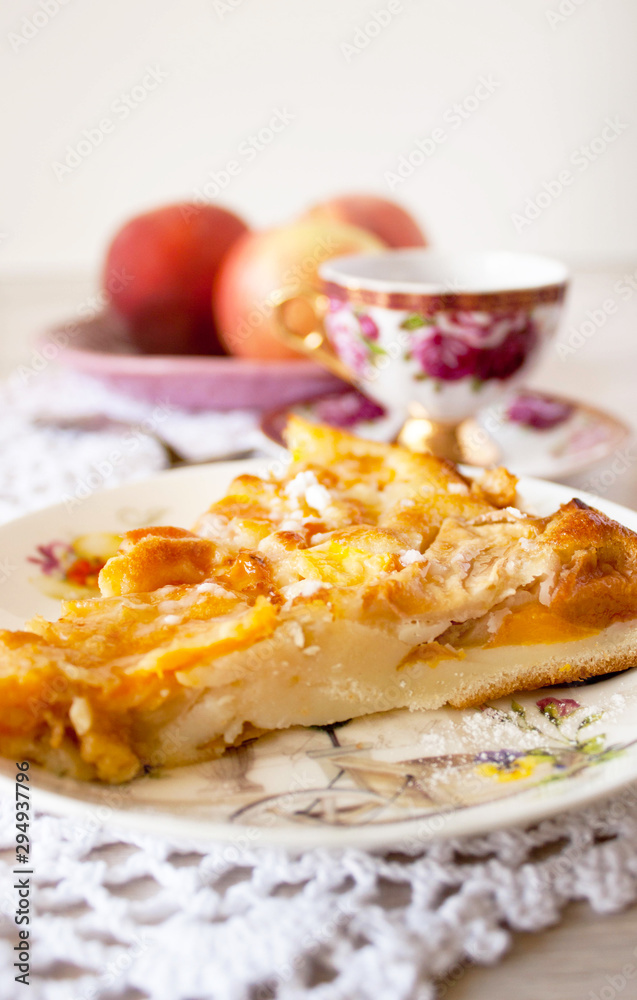 Homemade fruit apple apricot peach pie on white crochet napkin on white rustic table background Homemade fruit apple apricot peach pie on white crochet napkin on white rustic table background