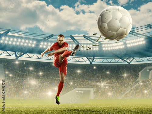 Soccer player kicks the ball