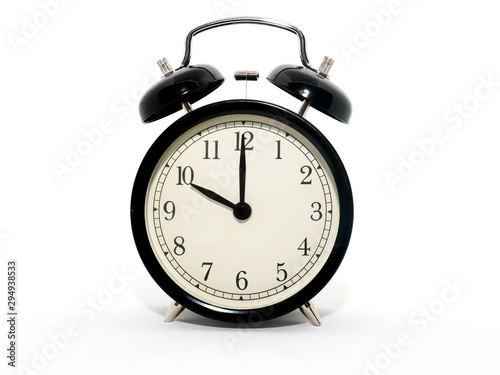 Old-style alarm clock, black and white, it's ten o'clock.