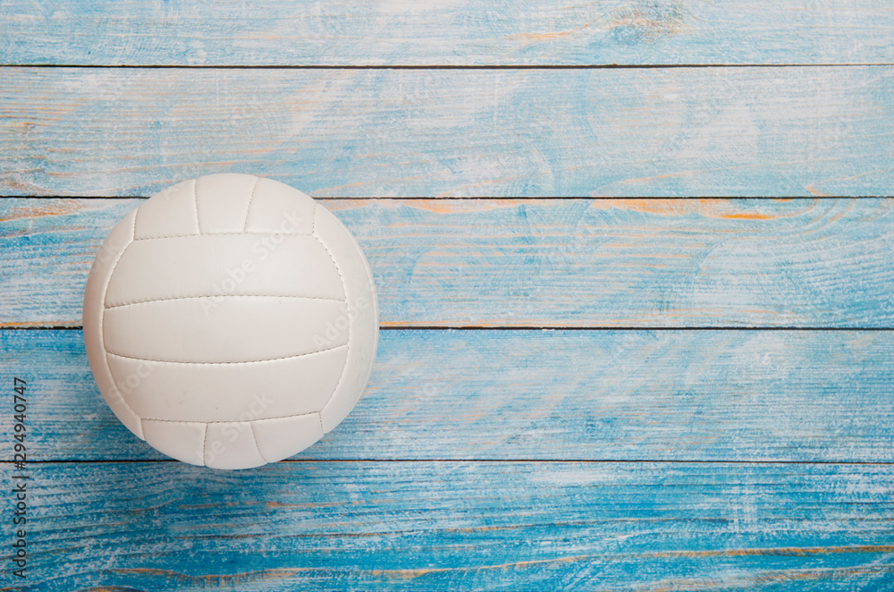 Close Up Of Volleyball Ball On Wooden Floor.
