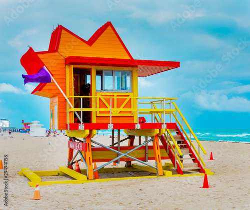 Red and orange lifeguard hut in Miami Beach on a cloudy day © Gabriele Maltinti