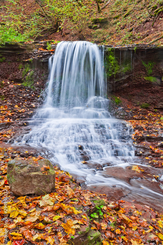 Fototapeta Naklejka Na Ścianę i Meble -  Beautiful waterfall on a mountain stream in the woods