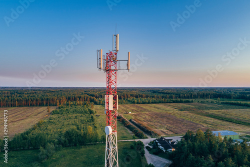 Mobile communication tower during sunset from above. photo