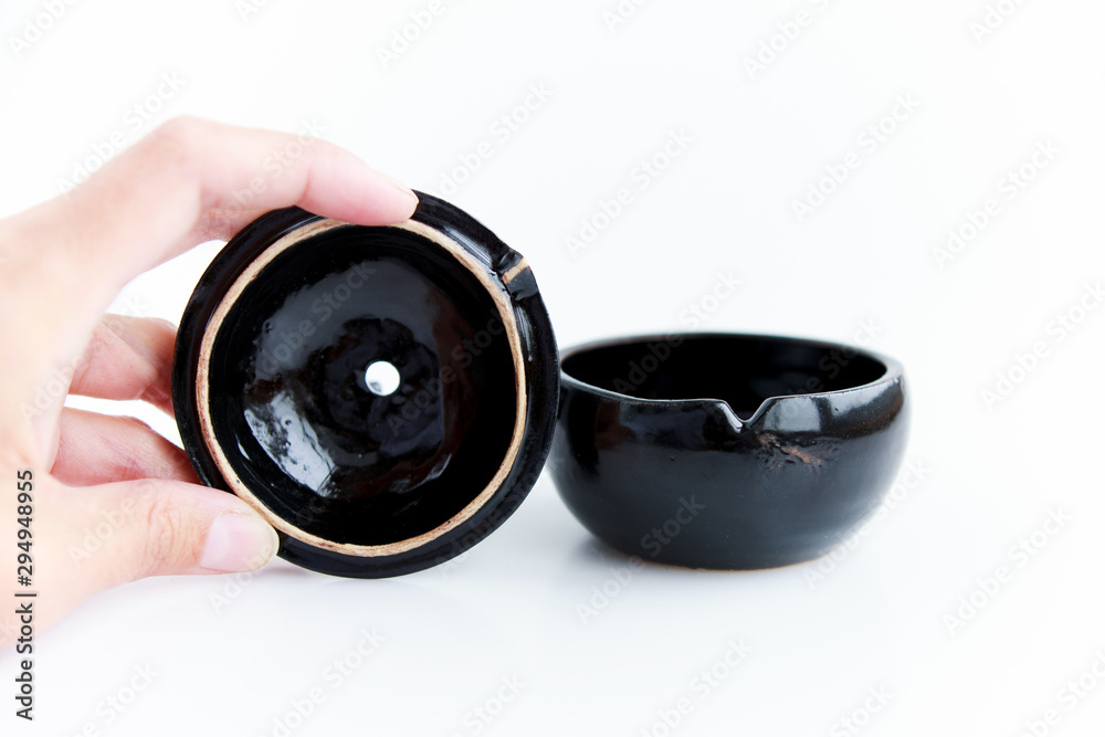 black clay pomegranate on a white background. original casket with a cover in the form of a pomegranate black clay pomegranate on a white background. original casket with a cover in the form of a pomegranate