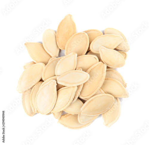 Pile of raw pumpkin seeds on white background  top view