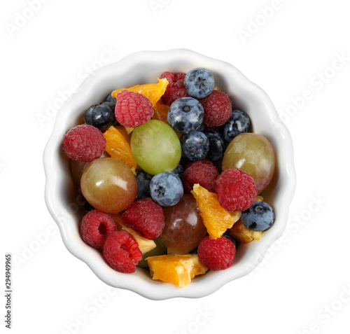 Fresh tasty fruit salad on white background  top view